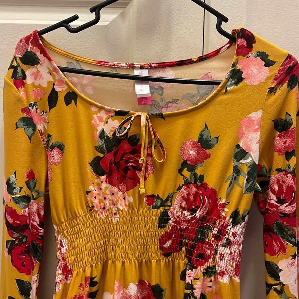 Mini Mustard color dress with red and pink flowers.